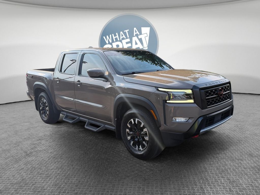 2023 Nissan Frontier PRO-X in Baja Storm — front three-quarter view
